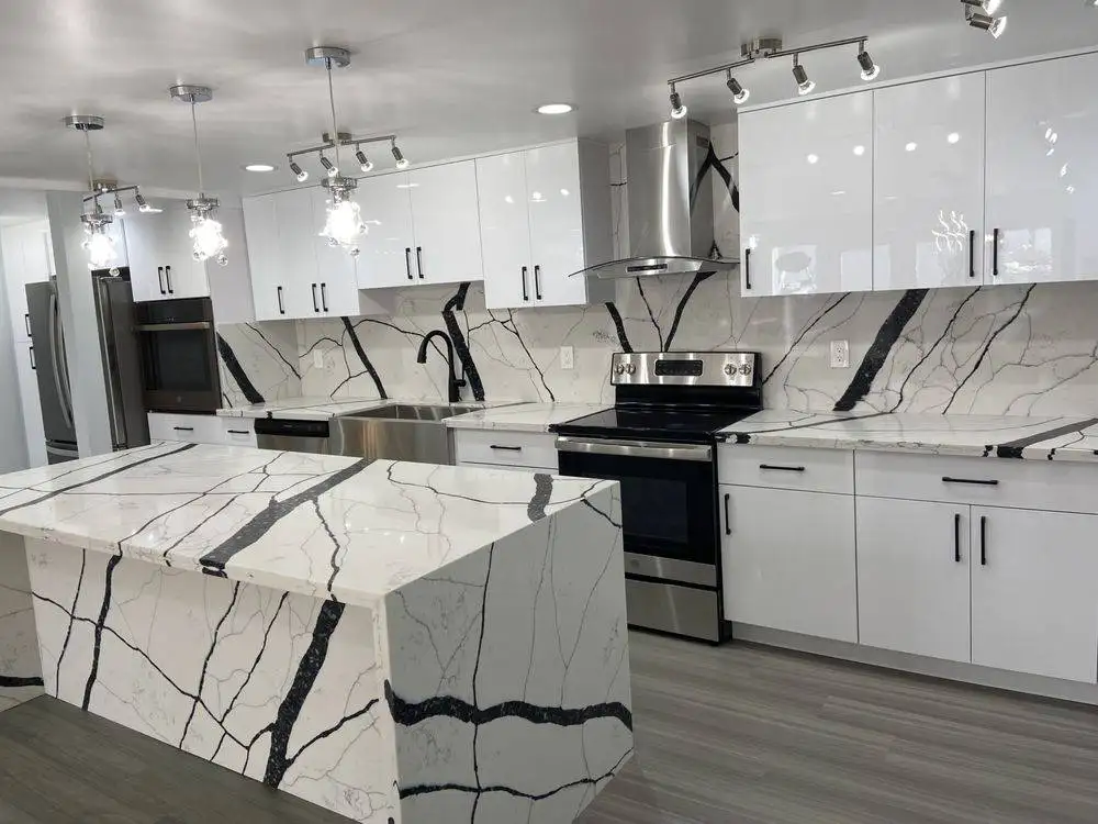 White quartz waterfall island with black veining in an Oahu kitchen